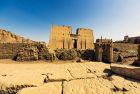 Travelers exploring the Temples of Edfu on 7-days Luxury Tours in Egypt.”